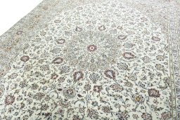 Backside of handmade 2000s Kashan rug showing knot structure and weave density