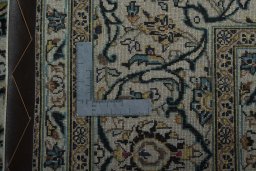 Backside of handmade 2000s Kashan rug showing knot structure and weave density