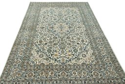 Surface texture of 2000s Kashan rug with natural Wool and intricate pattern
