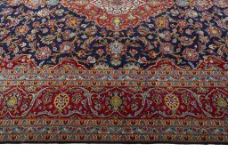 Corner detail of New Kashan rug showing border pattern and Cork pile