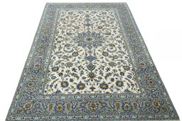 Surface texture of 2000s Kashan rug with natural Wool and intricate pattern