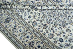 Close-up detail of 2000s Kashan rug from Iran / Persia showing Wool weave
