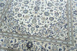 Close-up detail of 2000s Kashan rug from Iran / Persia showing Wool weave