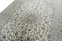 Backside of handmade 2000s Kashan rug showing knot structure and weave density
