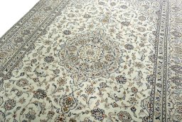 Backside of handmade 2000s Kashan rug showing knot structure and weave density