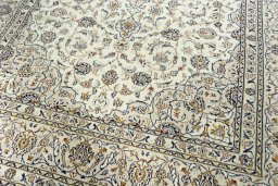 Close-up detail of 2000s Kashan rug from Iran / Persia showing Wool weave