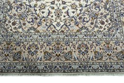 Full view of 2000s Kashan rug from Iran / Persia, 295 × 200 cm in Beige tones