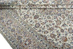 Close-up detail of 2000s Kashan rug from Iran / Persia showing Wool weave