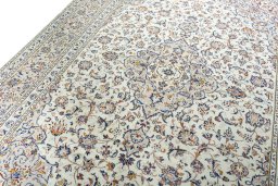 Backside of handmade 2000s Kashan rug showing knot structure and weave density