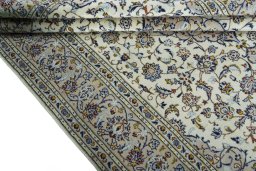 Close-up detail of 2000s Kashan rug from Iran / Persia showing Wool weave