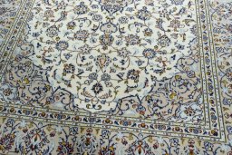 Close-up detail of 2000s Kashan rug from Iran / Persia showing Wool weave