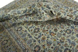 Surface texture of 2000s Kashan rug with natural Wool and intricate pattern