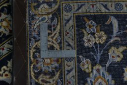 Surface texture of 2000s Kashan rug with natural Wool and intricate pattern
