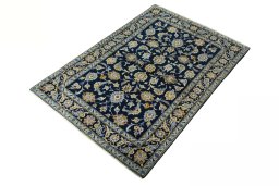 Corner detail of 2000s Kashan rug showing border pattern and Wool pile