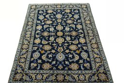 Surface texture of 2000s Kashan rug with natural Wool and intricate pattern
