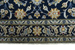 Close-up detail of 2000s Kashan rug from Iran / Persia showing Wool weave