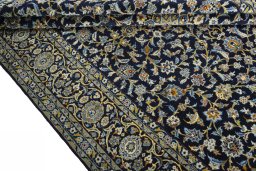 Close-up detail of 2000s Kashan rug from Iran / Persia showing Wool weave