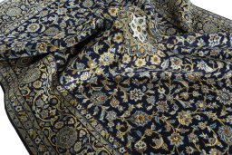 Surface texture of 2000s Kashan rug with natural Wool and intricate pattern