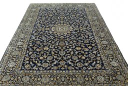Surface texture of 2000s Kashan rug with natural Wool and intricate pattern