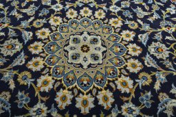 Central medallion detail of 2000s Kashan rug from Iran / Persia