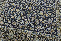 Close-up detail of 2000s Kashan rug from Iran / Persia showing Wool weave