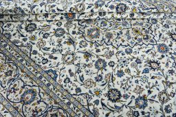 Close-up detail of 2000s Kashan rug from Iran / Persia showing Wool weave