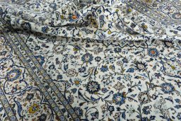 Surface texture of 2000s Kashan rug with natural Wool and intricate pattern