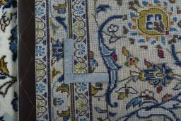 Backside of handmade 2000s Kashan rug showing knot structure and weave density