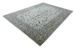 Corner detail of 2000s Kashan rug showing border pattern and Wool pile