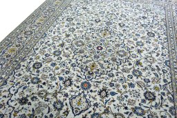 Backside of handmade 2000s Kashan rug showing knot structure and weave density