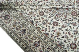 Close-up detail of 2000s Kashan rug from Iran / Persia showing Wool weave