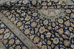 Close-up detail of 2000s Kashan rug from Iran / Persia showing Wool weave