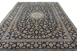 Surface texture of 2000s Kashan rug with natural Wool and intricate pattern