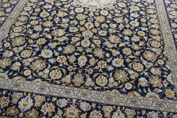Close-up detail of 2000s Kashan rug from Iran / Persia showing Wool weave