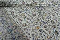 Close-up detail of 2000s Kashan rug from Iran / Persia showing Wool weave