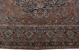 Corner detail of 1930s Kashan rug showing border pattern and Wool pile