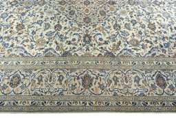 Corner detail of 2000s Kashan rug showing border pattern and Wool pile