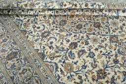 Close-up detail of 2000s Kashan rug from Iran / Persia showing Wool weave