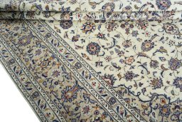 Close-up detail of 2000s Kashan rug from Iran / Persia showing Wool weave