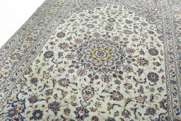 Backside of handmade 2000s Kashan rug showing knot structure and weave density