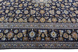 Corner detail of 2000s Kashan rug showing border pattern and Wool pile