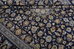 Close-up detail of 2000s Kashan rug from Iran / Persia showing Wool weave
