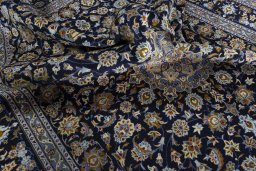 Surface texture of 2000s Kashan rug with natural Wool and intricate pattern
