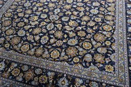 Close-up detail of 2000s Kashan rug from Iran / Persia showing Wool weave