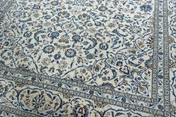 Close-up detail of 2000s Kashan rug from Iran / Persia showing Wool weave