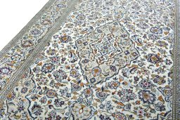 Backside of handmade 2000s Kashan rug showing knot structure and weave density