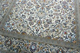 Close-up detail of 2000s Kashan rug from Iran / Persia showing Wool weave
