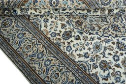 Close-up detail of 2000s Kashan rug from Iran / Persia showing Wool weave
