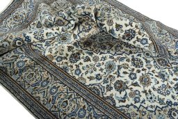 Surface texture of 2000s Kashan rug with natural Wool and intricate pattern