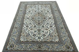 Surface texture of 2000s Kashan rug with natural Wool and intricate pattern